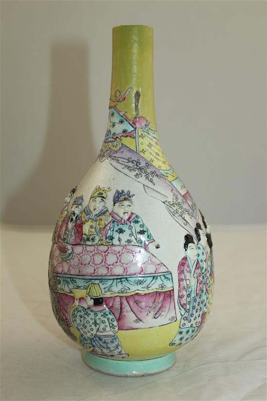 A Chinese moulded and enamelled biscuit porcelain bottle vase, Qianlong seal mark, 19th century, 22.5cm, neck restored
